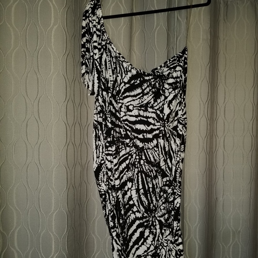 Off the shoulder form fitting dress.